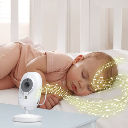 Bébé souriant et joyeux, allongé sur le ventre, regardant vers l'objectif, avec un babyphone blanc diffusant des notes de musique. Parfait pour illustrer la tranquillité et le bonheur du bébé sous surveillance.