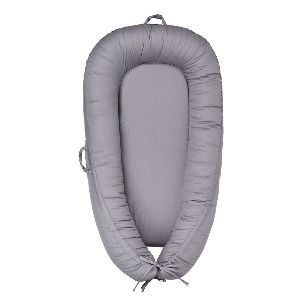 Réducteur de Lit Bébé Cocon Douillet - Univers du Sommeil Bébé