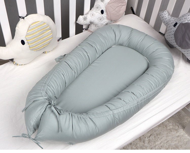 Réducteur de Lit Bébé Cocon Douillet - Univers du Sommeil Bébé